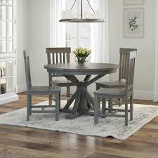 Glass tabletops can scratch or chip easily, though, and will likely have an abundance of fingerprints. Alamosa Solid Teak Wood Grey Round Dining Table Chair Set