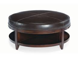 Warm yellow round cushioned ottoman stands at center of this cozy living room, awash in natural earth tones. Bernhardt Furniture Bernhardt Coffee Tables End Tables Round Ottoman Coffee Table Leather Ottoman Coffee Table Leather Coffee Table