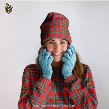 A woman is wearing tartan beanie with red plaid