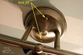 How to save money by changing your own bathroom lights. Changing Out A Light Fixture Bye Bye Hollywood Strip Light Pretty Handy Girl