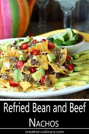Homemade Nachos Are Fun To Make And We Especially Love Them With This Combination Of Refried Beans And Beef Na In 2020 Refried Beans Nachos Beef Homemade Refried Beans