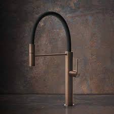 Blue and green wallpaper complements a marble sink vanity fitted with an antique brass vintage faucet positioned over a sink framed with gold greek trim. Gessi 316 Kitchen Cesello Semi Professional Single Lever Tap Sinks Taps Com Kitchen Taps Designer Kitchen Taps Lever Taps