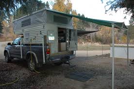 For them, it offers more comfort than camping in a standard tent with minimal supplies. Back Door Awning Truck Campers Wander The West