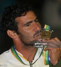 Cuba's Yandro Quintana -Gold Medal-, poses next to US Michael Zadick...  News Photo