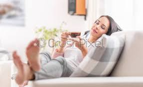Nancy proposed a picnic at the beach. Woman Drinking Coffee In The Morning By The Window Overlooking Stock Photo Crushpixel