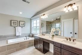 There's a sofa and an armchair in the living room but there isn't a television. Should You Have One Sink Or Two In Your Master Bathroom