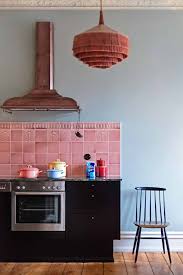 Victorian kitchen with white cabinetry and a peninsula paired with dark wood chairs. Introducing Modern Victorian And How To Do It In Your Home Emily Henderson