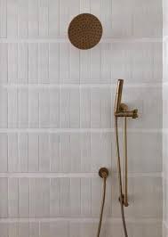 Modern Farmhouse Brick Paired With Thick White Grout Refined In Format And Rustic In Texture Modern Bathroom Trends Bathroom Wall Tile Master Bathroom Design