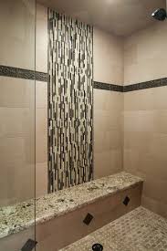 Nearly colorless but unmistakably pristine white, the illusion of space is achieved by being minimalist and embracing contrasting metallic fixtures like the mammoth rain shower head for superior water flow. Bathrooms Design Lovely Shower Area Idea With Sweet Mosaic Tiles Accent Bathroom Tile Glass Wal Shower Tile Designs Bathroom Shower Tile Master Bathroom Shower