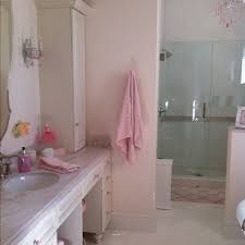Triangle wall designs make this room pop! Perfect Little Girls Bathroom Girls Bathroom Bathroom Plan Girl Bathrooms