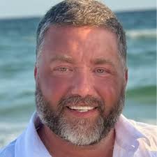 Estes congratulates Tim Jones