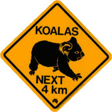 Black And White Striped Road Sign Australia Koalas May Cross The Road Or Be On The Roadside Australian Road Signs Australia Animals Koala