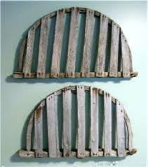 The netting in the center of the table carries home the lobster trap theme, and the polished wood and glass allow it to fit comfortably into a rustic or upscale setting. Downeast Nautical Salvage Lobster Traps