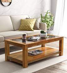 With a choice of round and square coffee tables available in wood, high gloss and glass topped options, you'll be sure to find the perfect option to complement. Buy Mckaine Solid Wood Coffee Table With Glass Top In Rustic Teak Finish Woodsworth By Pepperfry Online Contemporary Rectangular Coffee Tables Tables Furniture Pepperfry Product