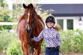 So proud of our student Miriam Bacon who did an amazing job riding her own  Drambuie in the FEI Children's Test during the CDI WEC Ocala show. She  showed great skill and