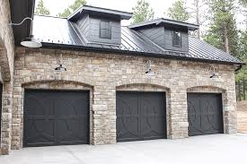 Modern white farmhouse exterior like the pop out window and metal roof accent. Our Modern Chateau With Farmhouse Flair The House Of Silver Lining