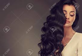 Select from premium shiny wavy hair of the highest quality. Young Black Haired Woman With Voluminous Shiny And Wavy Hair Stock Photo Picture And Royalty Free Image Image 99287439