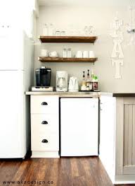 | this barn door cabinet holds a mini fridge and microwave! Our Imperfect White Kitchen