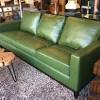 Orange leather upholstery lends this sofa a bright touch sure to make a statement in your living room ensemble. 1