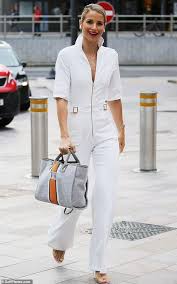 The rapper/producer/actor/designer/director is also touted as the heir to spiritual father pharrell williams' style credentials. Vogue Williams Totes A Monogrammed Bag As She Struts Into Itv Studios Vogue Flare Jumpsuit Fashion