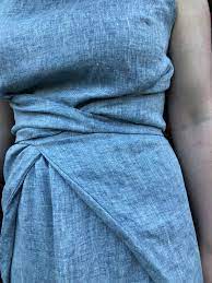 The dress has a neck band, and a vent at the back hem to add room for movement. Named Patterns Kielo Wrap Dress In Linen Poppykettle