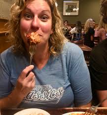 BBQ joint in strip mall with adult stores