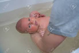 Improves weight gain and development. Childrens Therapy In A Warm Bath Bathing Baby In The Baby Bath Baby Massage Stock Photo Picture And Royalty Free Image Image 115590230