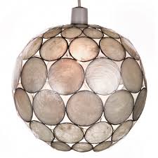 Beautifully handcrafted with pride by local artist. Pearl White Capiz Globe Shade