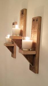Rustic candle sconce, wall candle holder lighting, wall hanging our primitive early lighting with blackened wood and metal candle holder has the industrial farmhouse flair with it's hand forging a primitive design simple hand tooled by pete reminiscent of early colonial pieces. Rustic Reclaimed Wood Wall Mounted Tea Light Candle Holder Etsy In 2020 Wood Candle Holders Diy Reclaimed Wood Decor Diy Sconce Candle