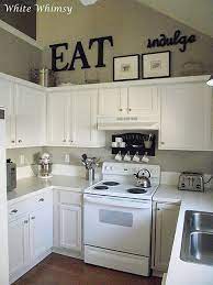 There's a wealth of clever kitchen ideas to make your scheme feel spacious. White Whimsy A House Tour Kitchen Cabinets Decor Decorating Above Kitchen Cabinets Above Kitchen Cabinets