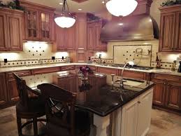 Black And Wood Kitchen Island Cherry Shaker Kitchen Cabinets Black Counter White Island Google Search Kitchen Backsplash Designs Wood Kitchen Kitchen And Bath Design