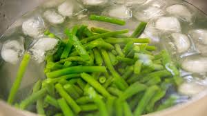 Carefully remove the strainer or vegetables with a slotted spoon and place in an ice bath. When And How To Blanch Vegetables