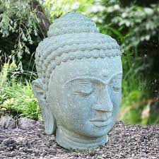 This molded lava stone thai buddha is deep in meditation. Besonderer Buddha Steinkopf Fur Den Garten