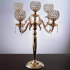 The candelabra is constructed of layers of rows with varying heights to give unique dimension to the piece. 25 Tall 5 Arm Gold Crystal Beaded Globe Metal Candelabra Candle Holder Set Tableclothsfactory
