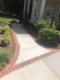 Usually, one edge has a rounded bull nosed edge which softens the look of the stone and also protects car tyres. Concrete Driveway And Sidewalk With Brick Borders In Alexandria Virginia Wright S Concrete