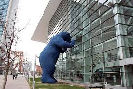 The big blue bear, the creation of late local artist lawrence argent, was installed in 2005, and was designed to appear as if it's looking into the lobby of the convention center located in the heart of downtown denver. Denver S Big Blue Bear By Lawrence Argent Design Is This