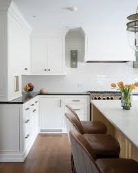 White grout on white tiles makes the whole backsplash look like a big white blur for a distance. White Glass Subway Tiles With White Grout Transitional Kitchen