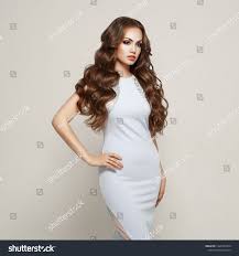 Beautiful Woman In Elegant White Evening Dress Brunette Girl With Long Healthy And Shiny Curly Hair Car White Evening Dress Shiny Curly Hair Beautiful Models