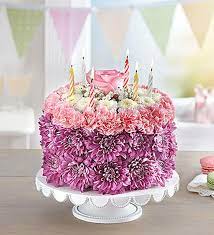 Our signature floral birthday cake may look good enough to eat, but don't it's actually crafted from fresh flowers such as mini carnations and poms! Birthday Wishes Flower Cake Pastel Portland Oregon Florist Nancy S Floral Gresham Or