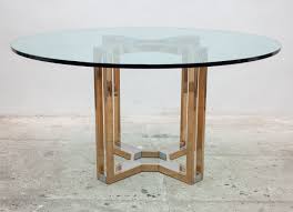 The nesting metal profiles are a smart solution for studio living and other small spaces. Romeo Rega Gold Chrome Round Glass Top Centre Table Italy 1970s 97156
