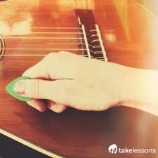 Let it rest on the front of the instrument. How To Hold Use A Guitar Pick Properly Beginner S Guide