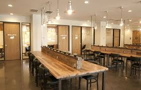 The Wood Desks And Doors Really Help Add That Organic Warmth To An Otherwise Sterile Space Coworking Space Coworking Space Coworking Space Design Coworking
