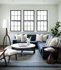 Black Trimmed Windows White Walls Striped Rug Navy Blue Sectional Mode Transitional Decor Bedroom Sectional Living Room Decor Transitional Living Rooms