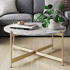 Made with solid oak that sports a charcoal black finish, this coffee table draws attention to your space and complements your style.solid wood provides a natural and long lasting piece of furniture.wipe wooden furniture down regularly. Piper White Faux Marble Gold Brass Metal Frame Round Modern Living Room Coffee Table Nathan James