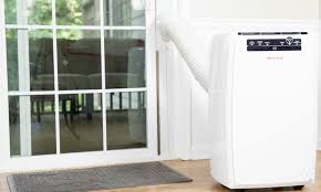 Portable air conditioner vented through wall with stealthy magnetic cover hose too short or no window? How To Vent A Portable Window Conditioner Without A Window