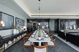 A likewise long kitchen, at one end of which is a more friendly dining area, completes a triumvirate of zones. Dining Room Projects By Kelly Hoppen