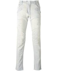 Men S Light Blue Ripped Jeans By Pierre Balmain Lookastic Shop online the latest fw20 collection of balmain for men on ssense and find the perfect jeans his proposal for a modern men's wardrobe takes in sharply tailored blazers, biker jeans and cargo pants, leather motorcycle jackets, loungewear.