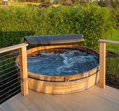 What Is The Difference Between A Hot Tub And A Spa Hot Tub Deck Design Expensive Hot Tubs Hot Tub Cover