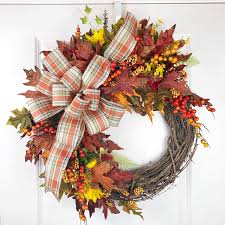 Clip the stems of the flowers or decorations to 3 to 4 inches with a pair of wire cutters or an old pair of scissors. Amazon Com Fall Grapevine Wreath Orange And Red Leaf Wired Bow Handmade