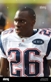 Oakland Raiders defensive back Phillip Adams (28) is tackled by Dallas  Cowboys running back Phillip Tanner (34) and strong safety Eric Frampton  (41) during the third quarter of an NFL preseason football